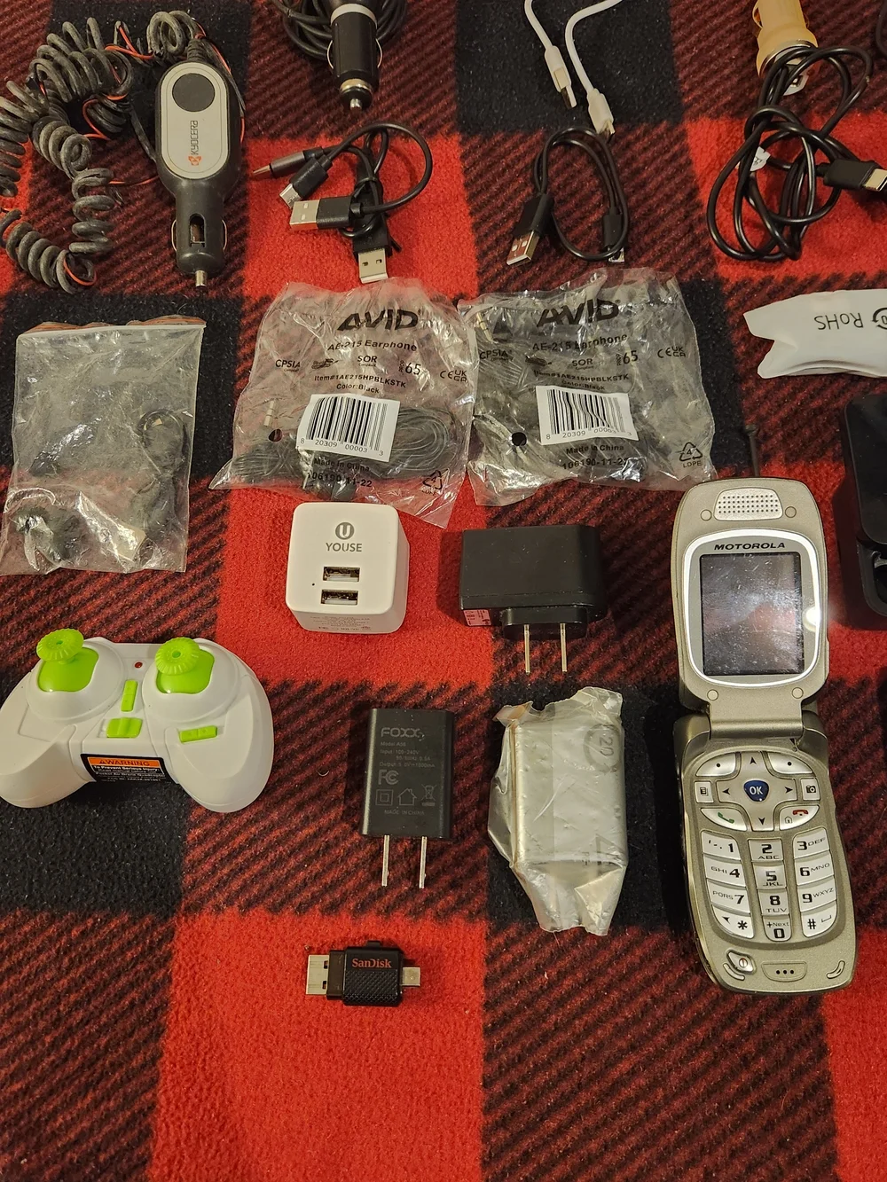 Elctronics Lot, Cellphones, Charging Cords, Remotes, And More